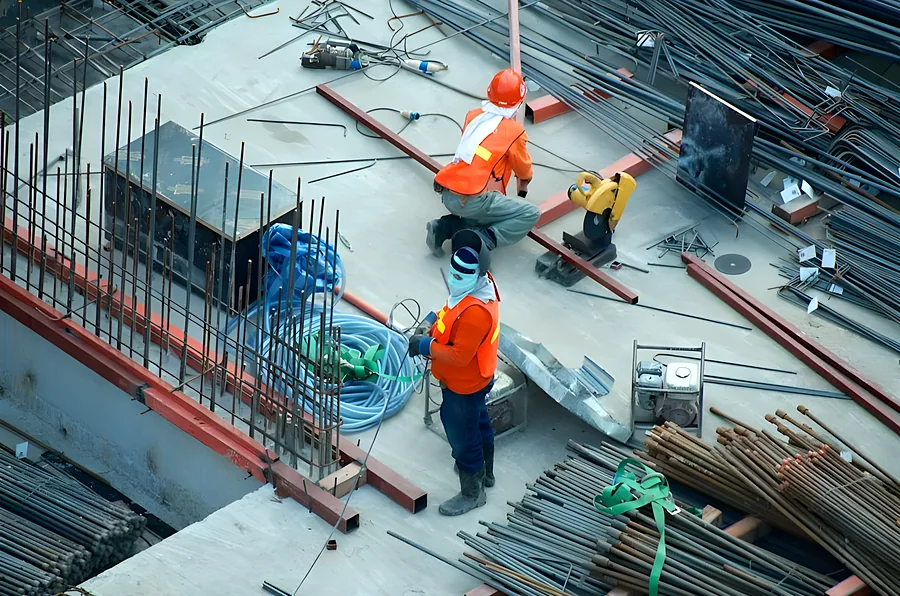 Construction crew working on rebar at a building site