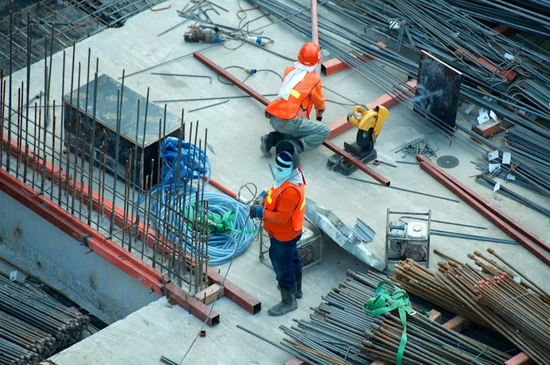 Construction crew working on rebar at a building site