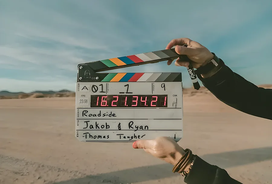 A film clapperboard held up on set