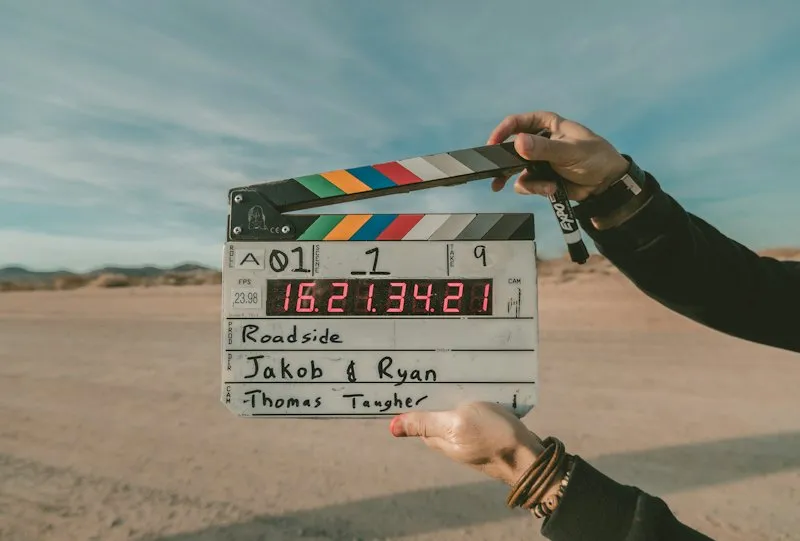 A film clapperboard held up on set